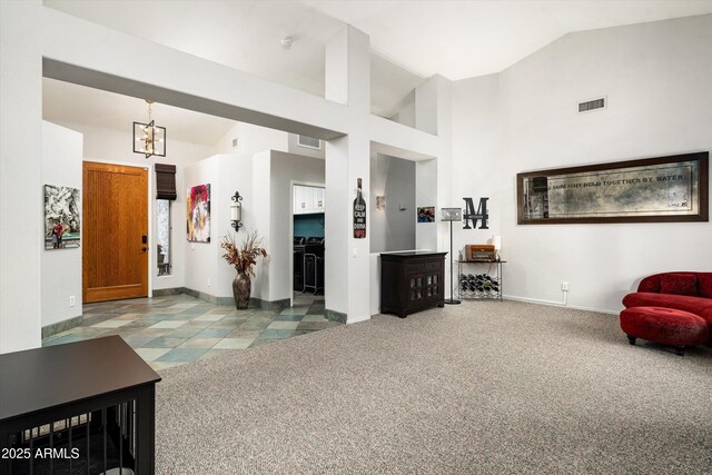 6326 W Misty Willow Ln, Glendale, AZ 85310 - carpeted living area with a chandelier, lofted ceiling, and baseboards