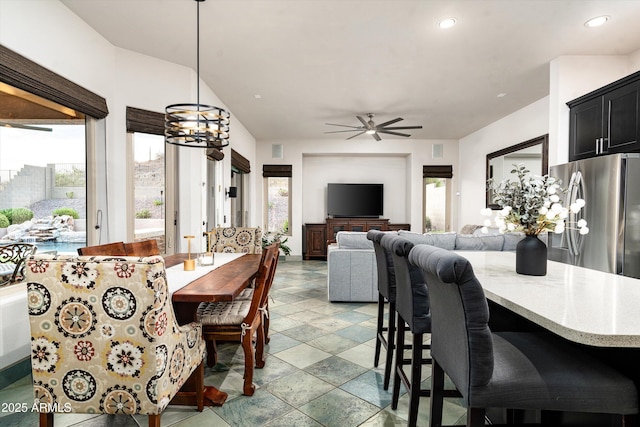 6326 W Misty Willow Ln, Glendale, AZ 85310 - dining room with plenty of natural light, recessed lighting, a chandelier, a ceiling fan, and light stone finish floors