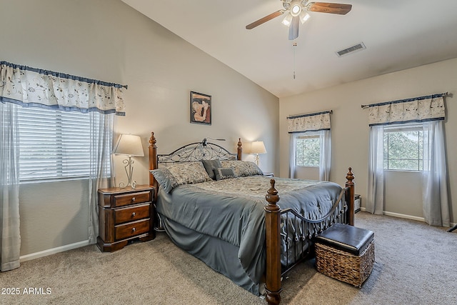 carpeted bedroom featuring visible vents, baseboards, ceiling fan, and vaulted ceiling