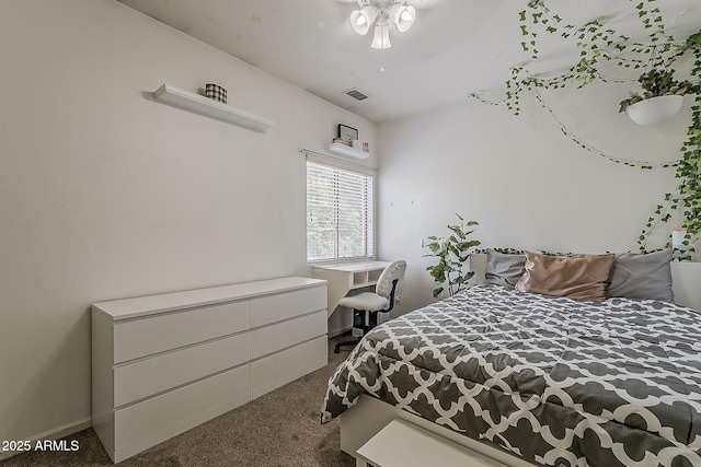 bedroom featuring baseboards, carpet flooring, and visible vents
