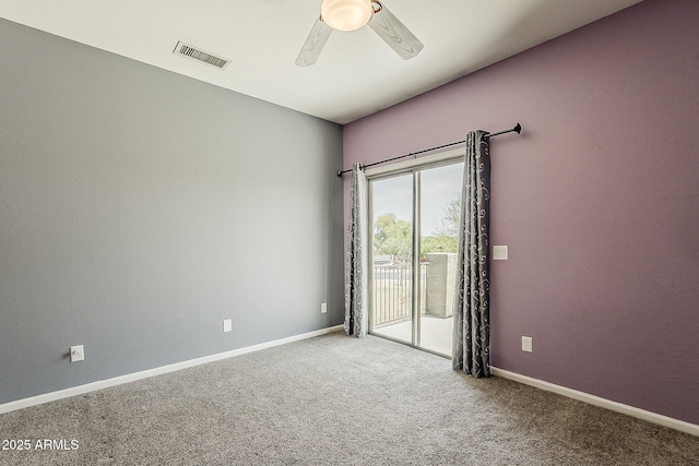unfurnished room with visible vents, a ceiling fan, carpet, and baseboards