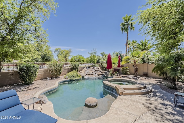 view of pool featuring a fenced in pool, a fenced backyard, an in ground hot tub, and a patio area