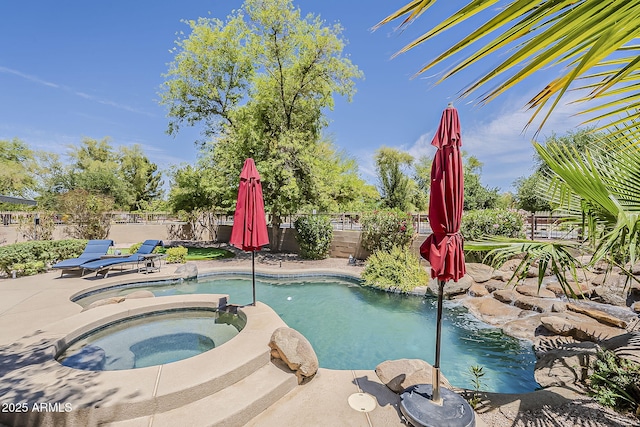 view of swimming pool featuring a fenced in pool, a fenced backyard, an in ground hot tub, and a patio