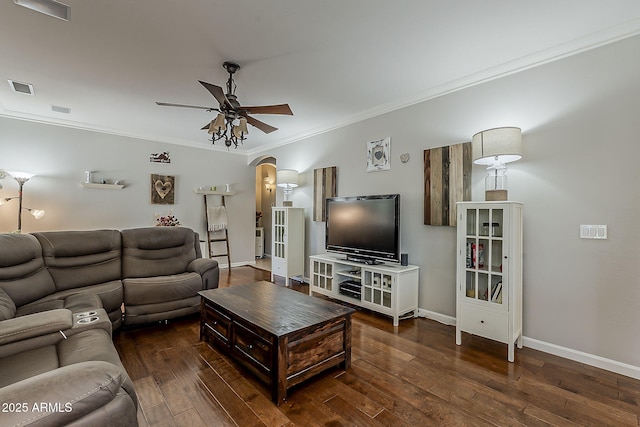 living area featuring crown molding, wood-type flooring, arched walkways, a ceiling fan, and visible vents