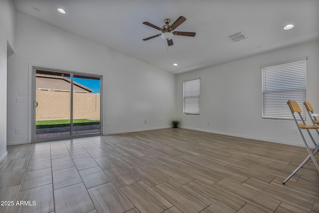 empty room featuring lofted ceiling and ceiling fan