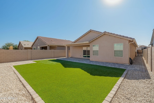 rear view of house with a patio