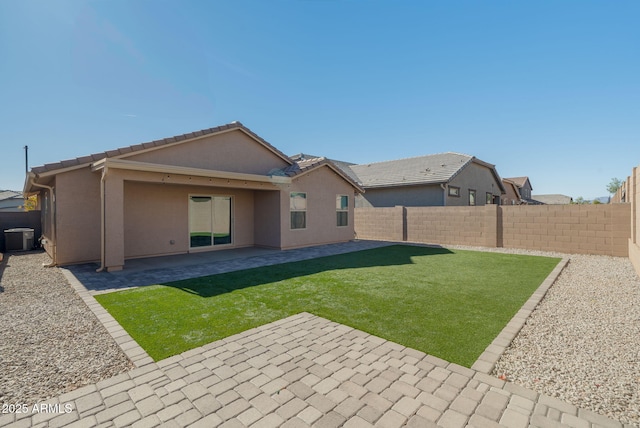 rear view of house featuring a patio, central AC unit, and a lawn