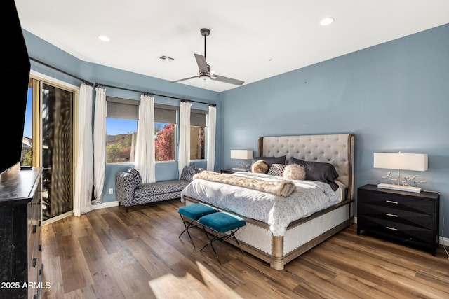 bedroom with recessed lighting, visible vents, baseboards, and wood finished floors