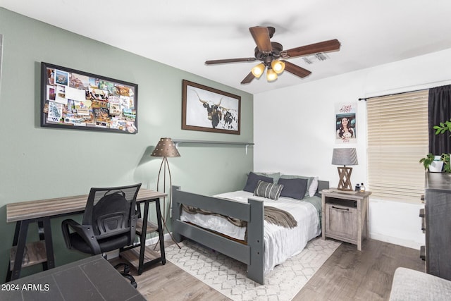 bedroom with hardwood / wood-style floors and ceiling fan