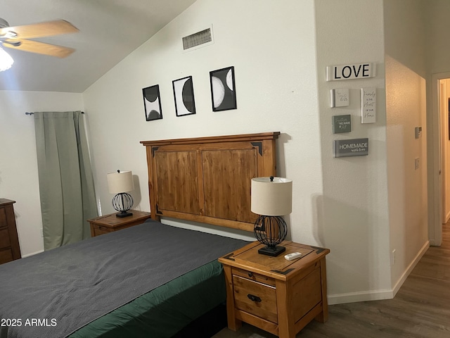 bedroom with dark wood-type flooring, ceiling fan, and lofted ceiling