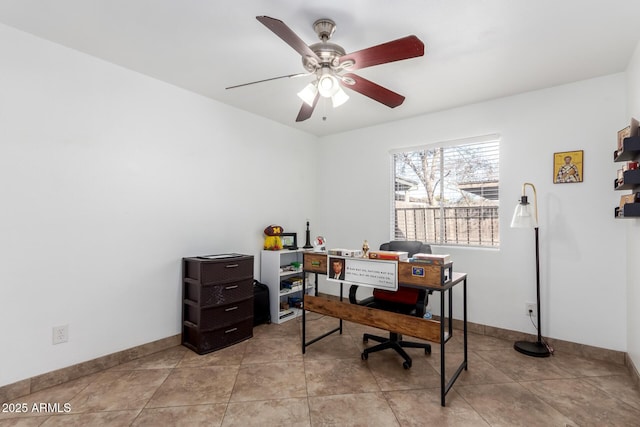 tiled office featuring ceiling fan