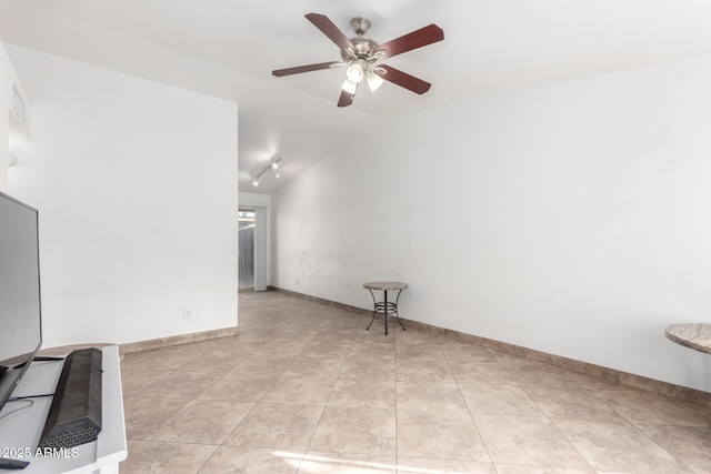 unfurnished room with light tile patterned flooring, ceiling fan, and vaulted ceiling