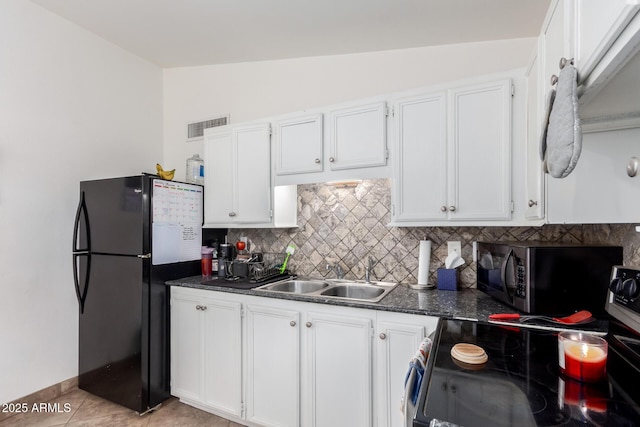 kitchen featuring white cabinetry, sink, decorative backsplash, and black appliances