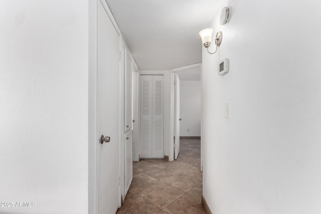 corridor with light tile patterned flooring