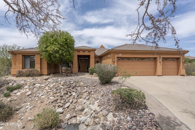 8698 E Preserve Way, Scottsdale, AZ 85266 - view of front of property with a garage, concrete driveway, stucco siding, and a tiled roof