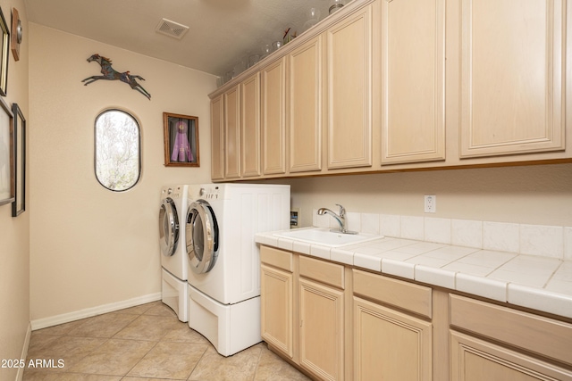 8698 E Preserve Way, Scottsdale, AZ 85266 - washroom with cabinet space, washing machine and clothes dryer, and light tile patterned flooring