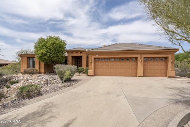 8698 E Preserve Way, Scottsdale, AZ 85266 - view of front of house featuring driveway, a garage, and stucco siding