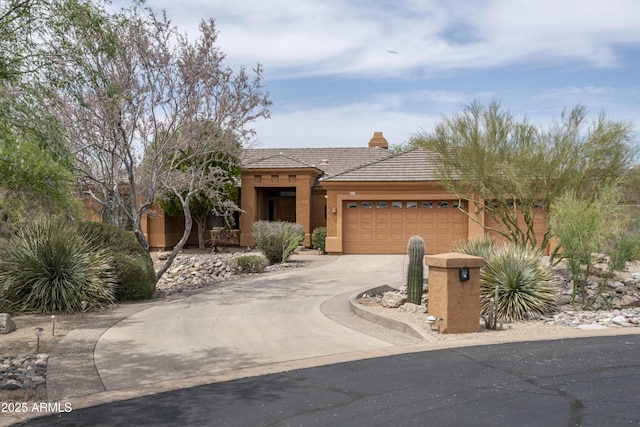 8698 E Preserve Way, Scottsdale, AZ 85266 - view of front facade with stucco siding, a garage, driveway, a tiled roof, and a chimney