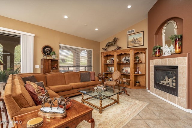 8698 E Preserve Way, Scottsdale, AZ 85266 - living area with lofted ceiling, light tile patterned floors, recessed lighting, and a fireplace