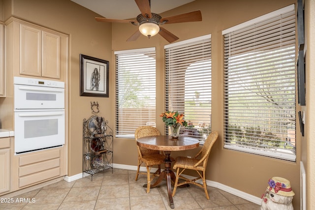 8698 E Preserve Way, Scottsdale, AZ 85266 - dining space featuring a ceiling fan, healthy amount of natural light, and light tile patterned floors