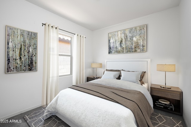 bedroom featuring dark carpet