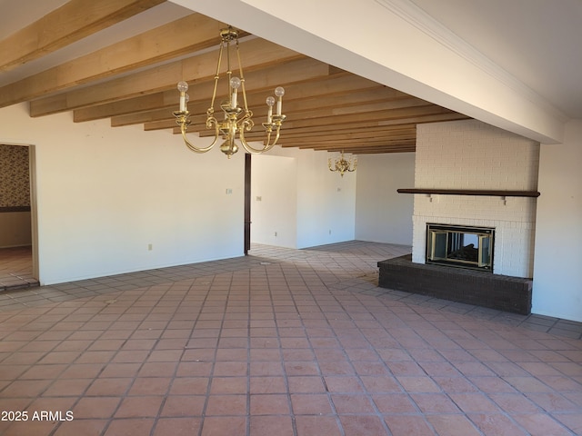 unfurnished living room featuring a brick fireplace, beamed ceiling, and a notable chandelier