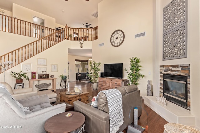 30013 N Candlewood Dr, San Tan Valley, AZ 85143 - living room with visible vents, ceiling fan, a high ceiling, and wood finished floors