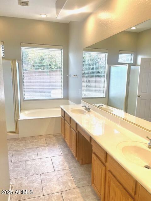 bathroom with vanity, tile patterned floors, and separate shower and tub