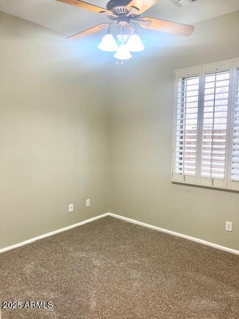 unfurnished room featuring plenty of natural light, carpet flooring, and ceiling fan