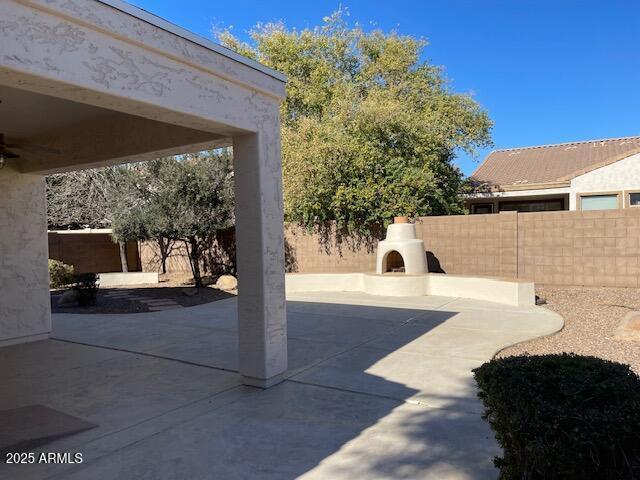 view of patio / terrace with an outdoor fireplace