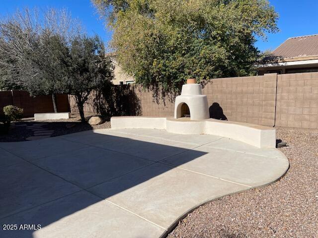 view of patio featuring an outdoor fireplace