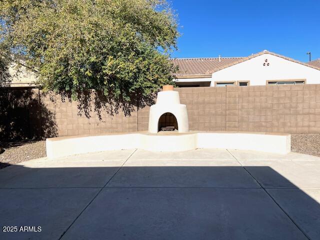 view of patio / terrace with exterior fireplace