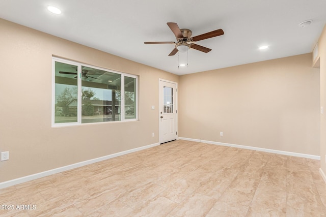 unfurnished room featuring ceiling fan