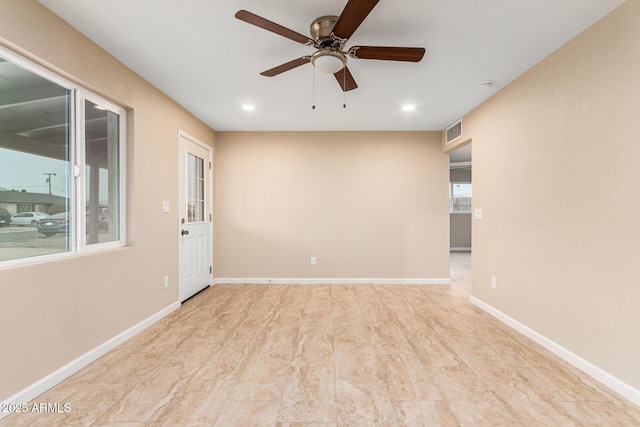 empty room featuring ceiling fan