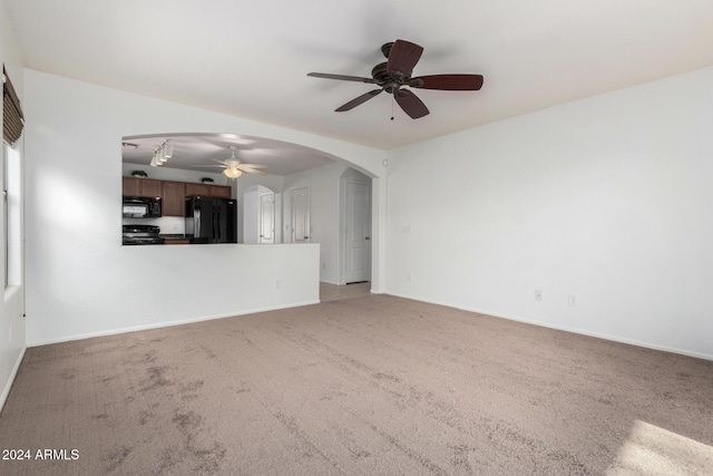 unfurnished living room with carpet flooring and ceiling fan