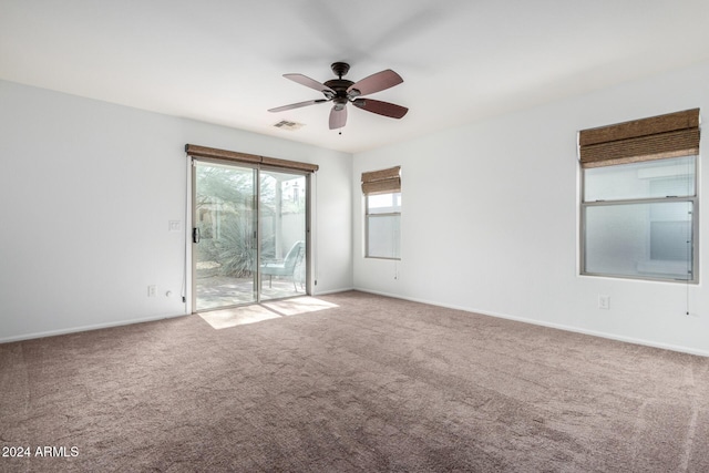 empty room with carpet flooring and ceiling fan