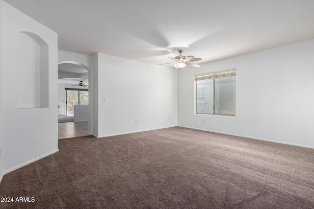 carpeted empty room with ceiling fan