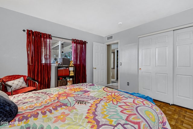 bedroom with visible vents and a closet