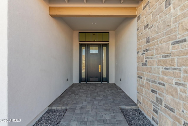 entrance to property featuring elevator