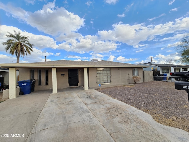 single story home with a carport