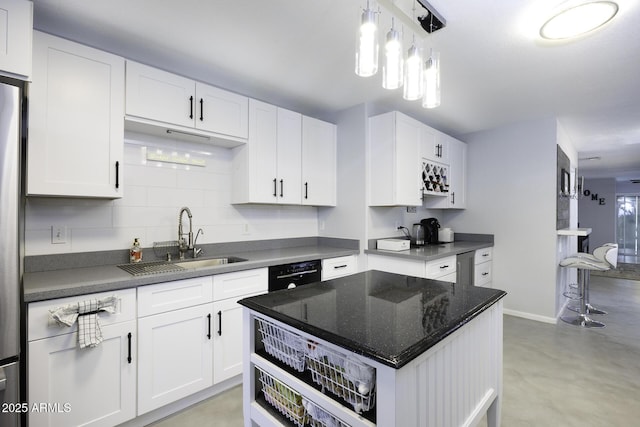 kitchen featuring white cabinetry, sink, and dishwasher