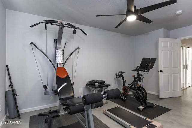 exercise area with ceiling fan and a textured ceiling