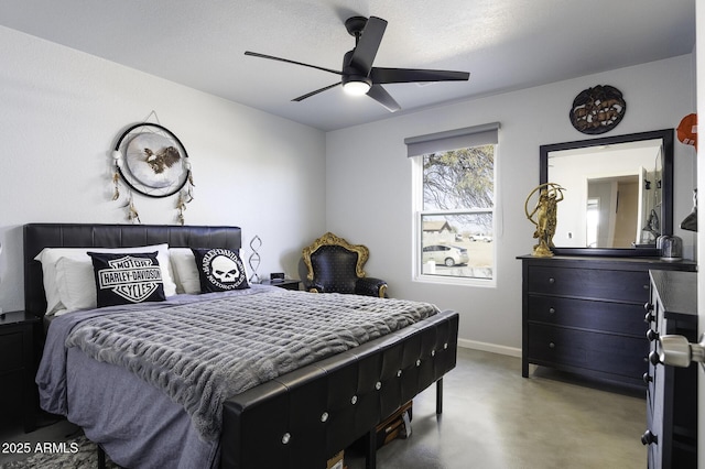 bedroom with ceiling fan and concrete flooring