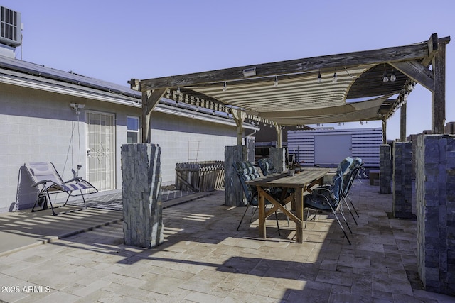 view of patio with a pergola and a storage shed