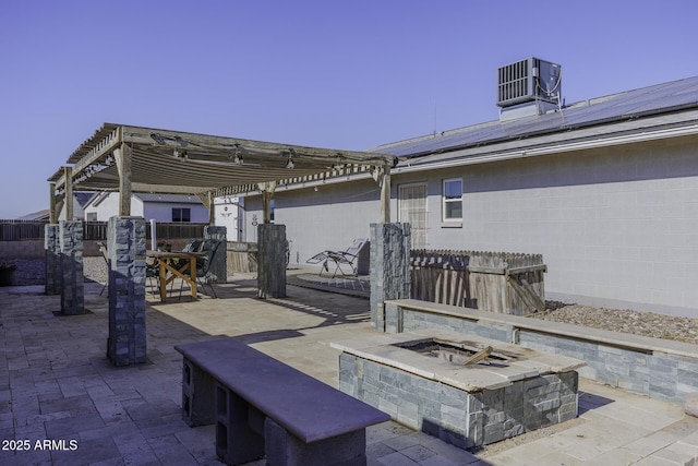 view of patio with a pergola, a fire pit, and central AC unit