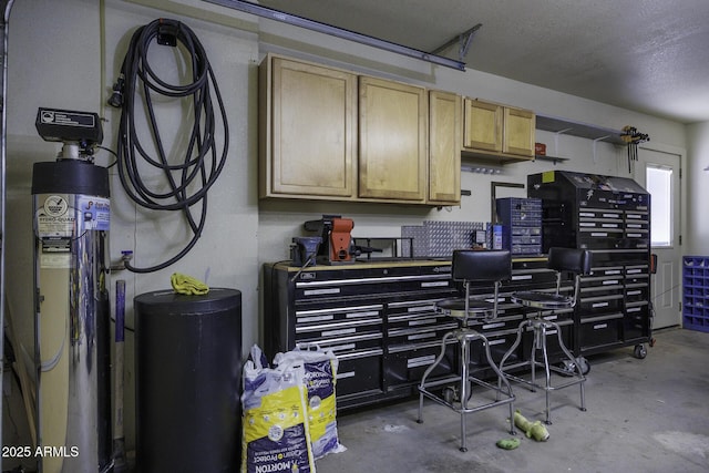 interior space featuring a textured ceiling, light brown cabinetry, and concrete floors