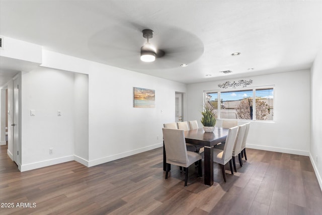 dining room featuring dark wood-type flooring and ceiling fan