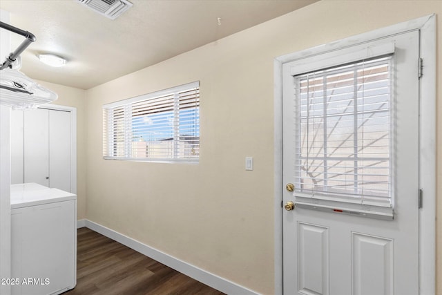 laundry area featuring washer / clothes dryer and dark hardwood / wood-style floors