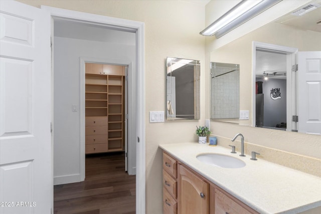 bathroom with vanity and wood-type flooring