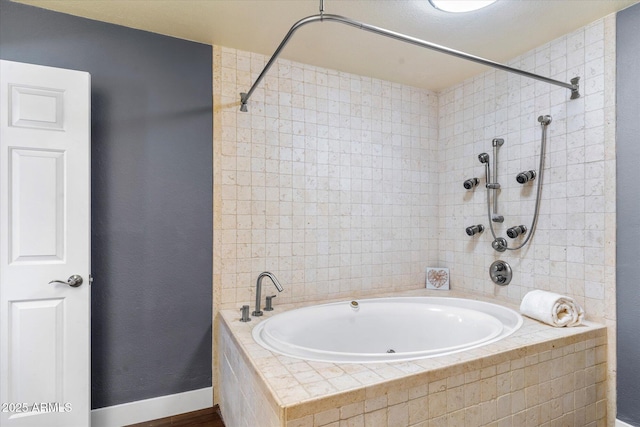 bathroom featuring separate shower and tub